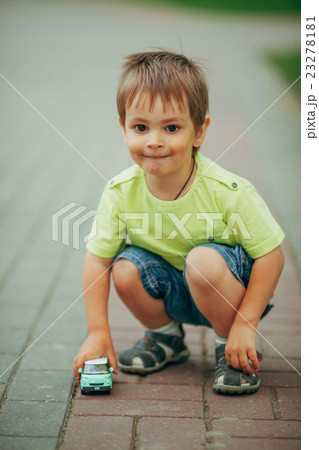 little boy playing with toy car little boy playing with toy car 23278181