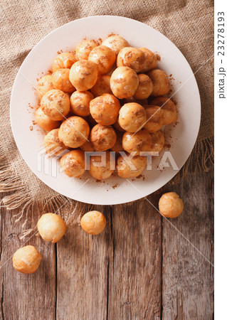 loukoumades donuts with honey and cinnamon closeup loukoumades donuts with honey and cinnamon closeup 23278193