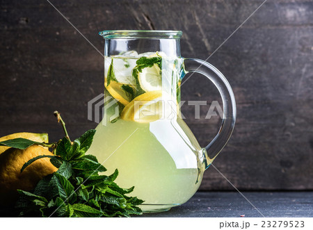 Homemade lemonade with mint, lemon slices and ice 23279523