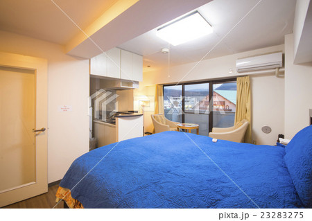 interior of bedroom with blue bed linen 23283275