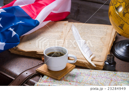 USA flag near opened book. USA flag near opened book. 23284949