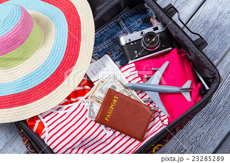 Camera in suitcase with clothes. 23285289