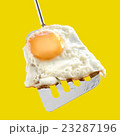 Fried egg and metallic spatula 23287196