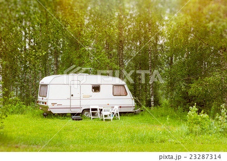 Camping van on a green meadow. Campsite, Lappeenra Camping van on a green meadow. Campsite, Lappeenra 23287314
