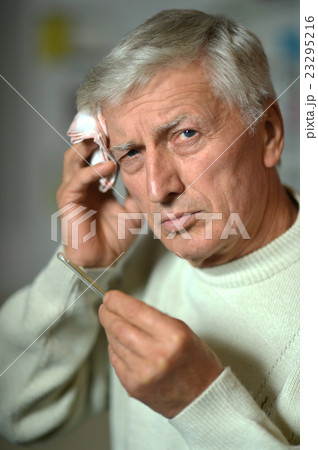 Sick old man on grey 23295216