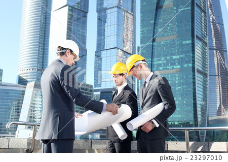 Architects with blueprint 23297010