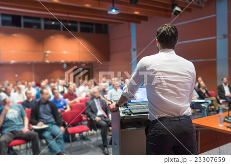 Public speaker giving talk at Business Event. Public speaker giving talk at Business Event. 23307659