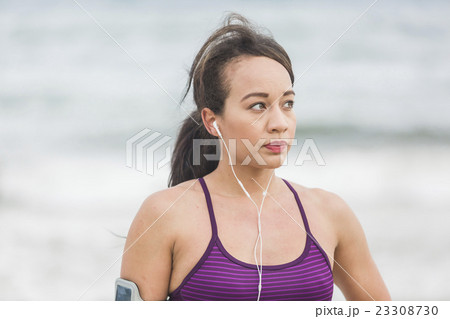 Portrait of young sports woman standing on the Portrait of young sports woman standing on the 23308730