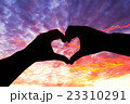 Silhouette hand in heart shape and beautiful sky 23310291