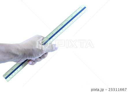 Hand holding wooden scale ruler. 23311667