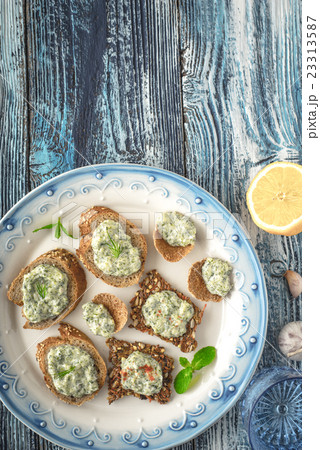 Plate with different bread with tzatziki on table 23313587