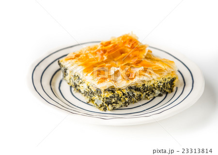 Piece of Greek pie spanakopita on ceramic plate 23313814
