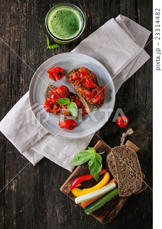 Bruschetta with baked tomatoes 23314482