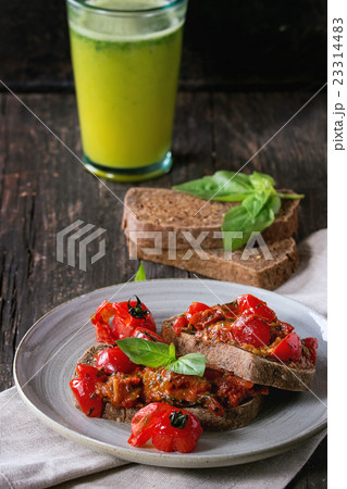 Bruschetta with baked tomatoes 23314483