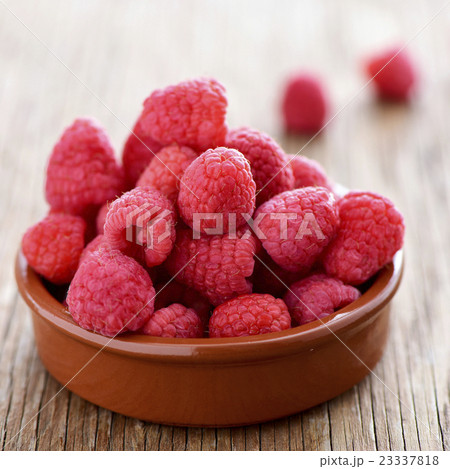 raspberries on a wooden table 23337818
