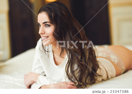 Sexy young woman in lingerie posing on the bed 23347386