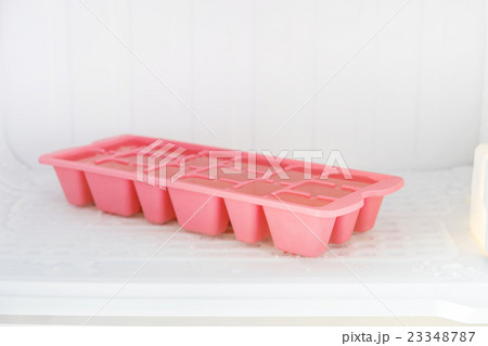 Plastic ice tray in the freezer. 23348787