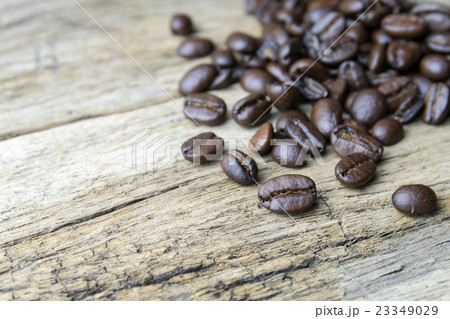 Coffee beans on wood background Coffee beans on wood background 23349029