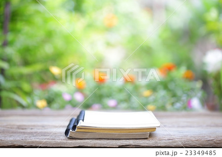 Notebook on wooden table Notebook on wooden table 23349485