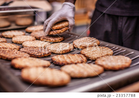 Burgers on barbecue 23357788