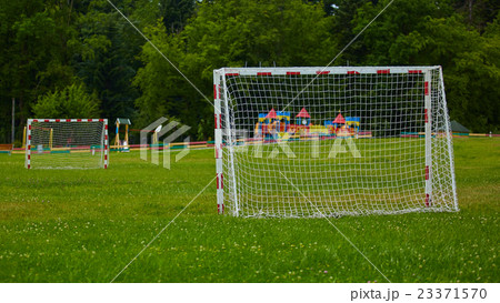 view of a net on vacant soccer pitch. view of a net on vacant soccer pitch. 23371570
