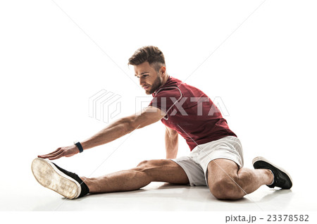 Happy male athlete doing exercise 23378582