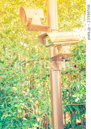 Close up of security surveillance camera . ( Filtered image processed vintage effect. ) Close up of security surveillance camera . ( Filtered image processed vintage effect. ) 23399506