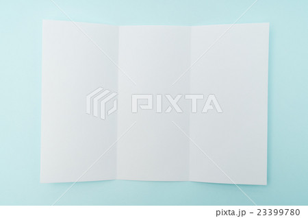 Trifold white template paper on blue background . 23399780