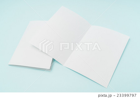 Bifold white template paper on blue background . 23399797