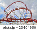 a steel roller coaster on cloudy 23404960