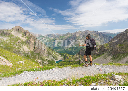 Backpacker hiking on footpath Backpacker hiking on footpath 23405257