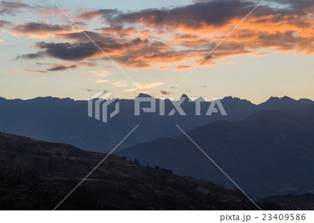 Mountain silhouettes during sunset 23409586