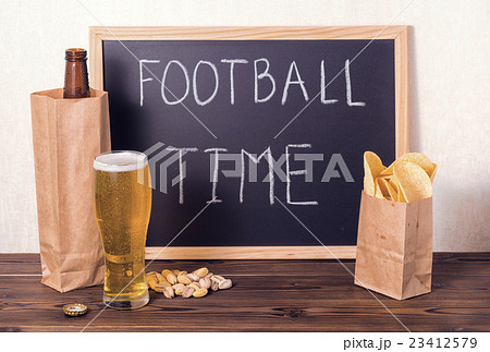 football fans setting of beer bottle in paper bag football fans setting of beer bottle in paper bag 23412579