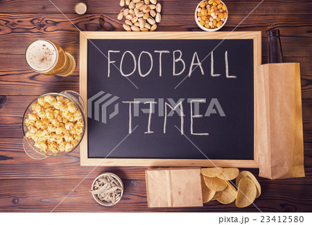 football fans concept of beer bottle in paper bag 23412580
