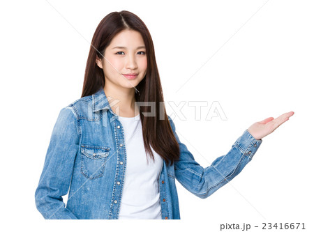 asian young woman with hand present some information 23416671