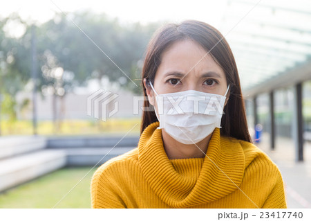 Young Woman use of the face mask Young Woman use of the face mask 23417740