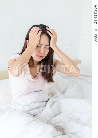Asian woman suffer from headache 23418566