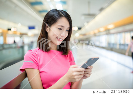 Young woman hold with cellphone Young woman hold with cellphone 23418936