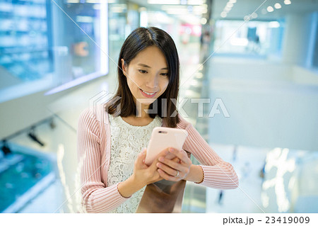 Woman look at the cellphone Woman look at the cellphone 23419009
