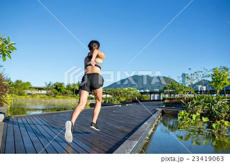 Runner athlete running at park Runner athlete running at park 23419063