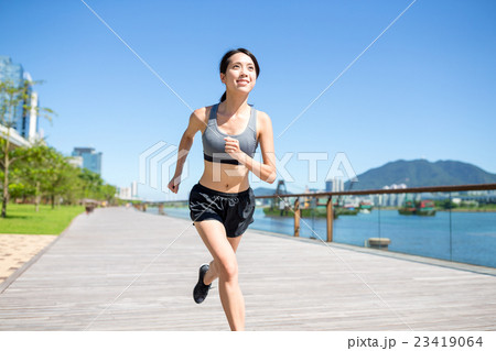 Young woman jogging in summer Young woman jogging in summer 23419064