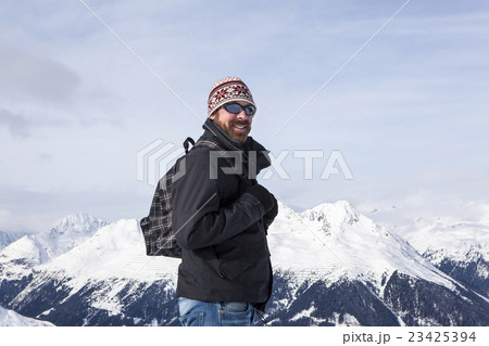 Young man enjoys the view in the mountains Young man enjoys the view in the mountains 23425394