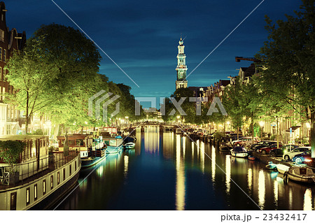 Westerkerk church tower at canal in Amsterdam, Netherlands Westerkerk church tower at canal in Amsterdam, Netherlands 23432417