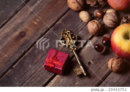 apples, fir-cones, gift, key and nuts apples, fir-cones, gift, key and nuts 23433751