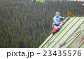 Man Working on the Roof, Checking Safety Gear 23435576