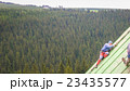 Man Working on the Roof, Scraping the Paint 23435577
