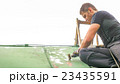 Man Working on the Roof, Sandering Paint 23435591
