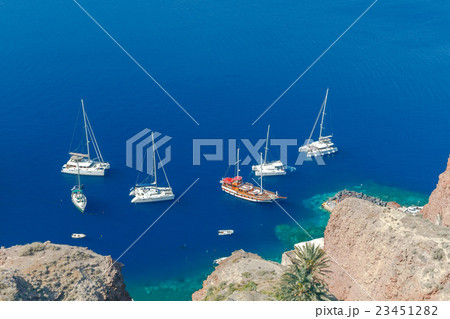 The old fishing harbor in the village Oia. The old fishing harbor in the village Oia. 23451282