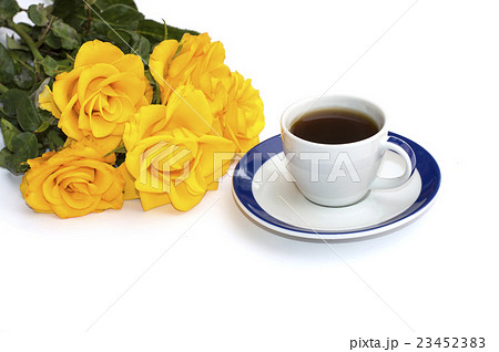 coffee on a saucer and a bouquet of yellow roses coffee on a saucer and a bouquet of yellow roses 23452383