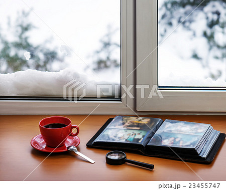 Red cup of coffee or tea with a metal spoon 23455747